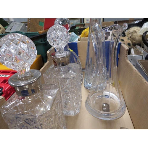 57 - A tray of assorted cut glass to include decanters