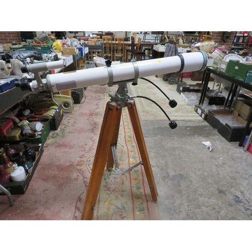 76 - A vintage astronomical telescope on tripod stand