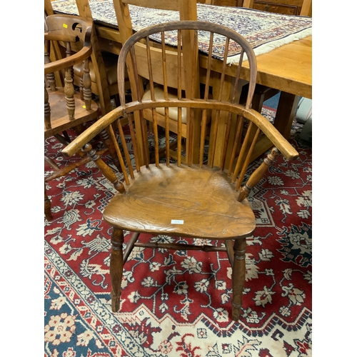 771 - A traditional antique elm Windsor armchair