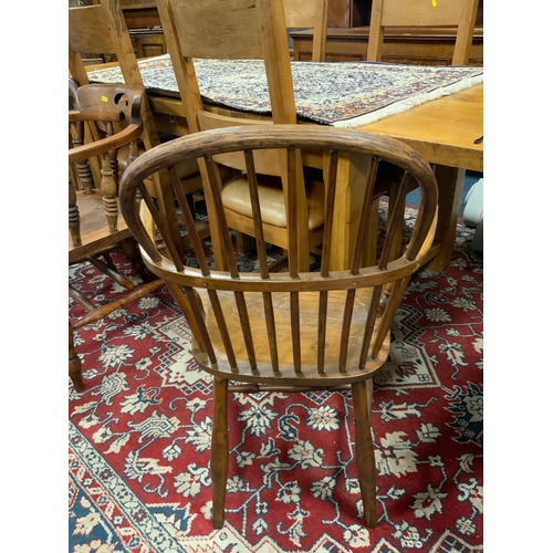 771 - A traditional antique elm Windsor armchair