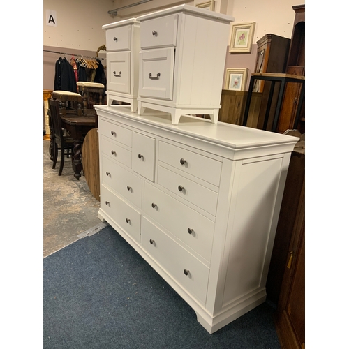 775 - A large white modern multi drawer chest W 171 cm, together with a pair of bedside chests. (3)