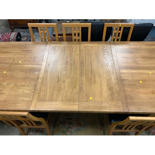 777 - A huge modern oak extending dining table with a set of ten chairs L 200 cm W 100 cm - Extended L 280... 