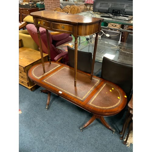 781 - A reproduction mahogany oval coffee table with leather top together with a smaller mahogany console ... 