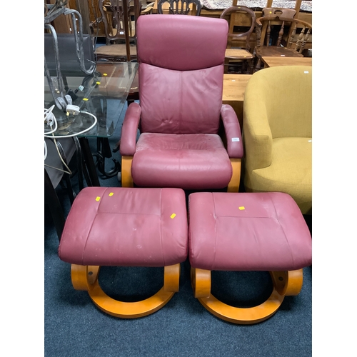 796 - A modern upholstered Stressless style armchair and two foot stools