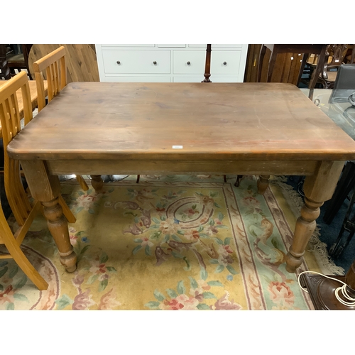 802 - A farmhouse style pine kitchen table W 136 cm