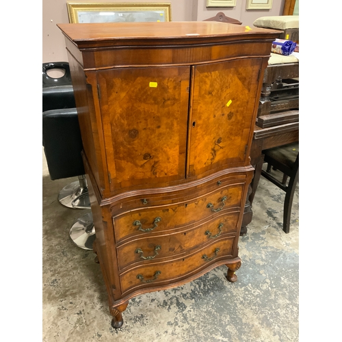 809 - A walnut serpentine fronted drinks cabinet on chest H 125 cm W 68 cm