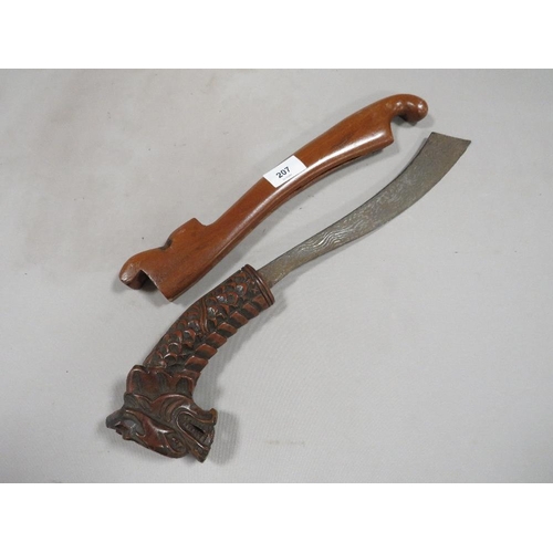 207 - A vintage Far Eastern dagger with wooden scabbard and carved dragons head to handle