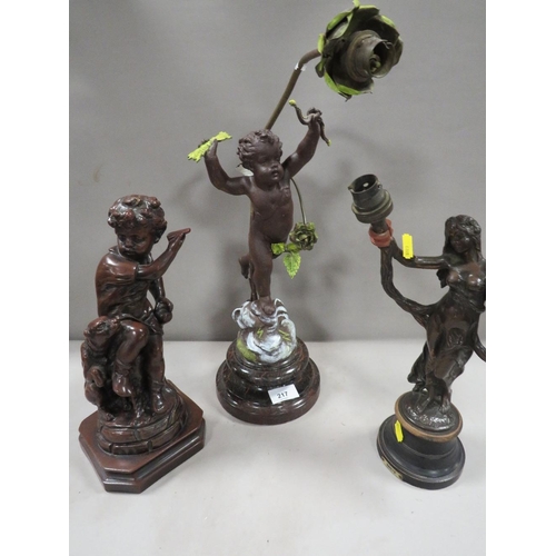 217 - A cast metal cherubic lamp A/F together with a bronze effect lamp base  and a cast metal figural lam... 