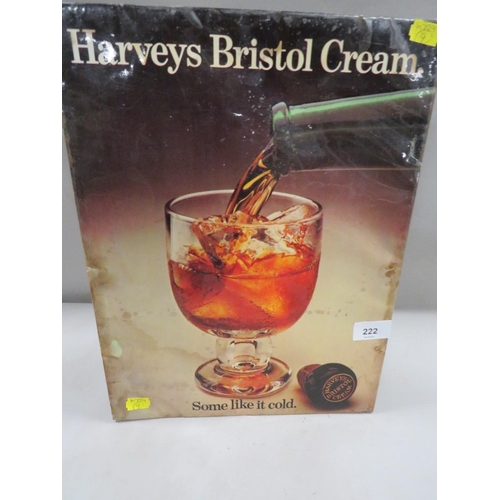 222 - A vintage metal advertising sign laid on card for Harvey's Bristol Cream