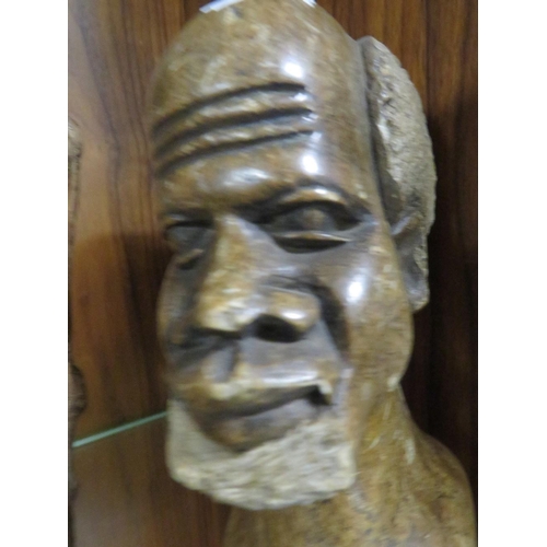 228 - A small carved stone bust of a gentleman together with a treen example