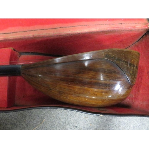 245 - A cased mandolin with label inside