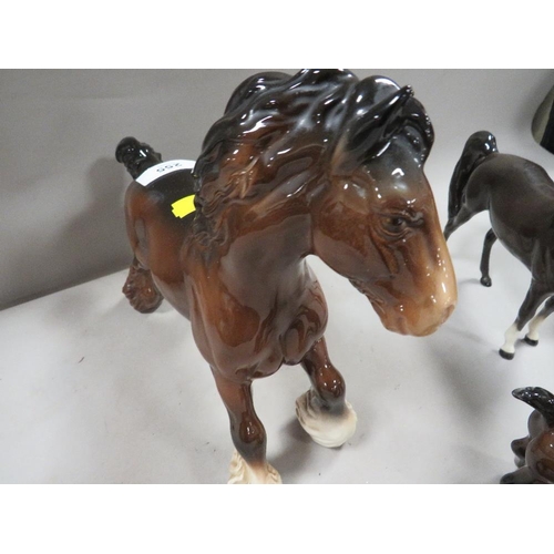 255 - A collection of five Beswick horses to include a cantering shire