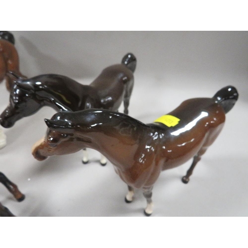 255 - A collection of five Beswick horses to include a cantering shire