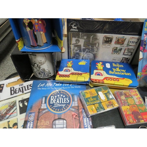 263 - A collection of assorted modern Beatles memorabilia, to include a collection of badges, KNex figures... 