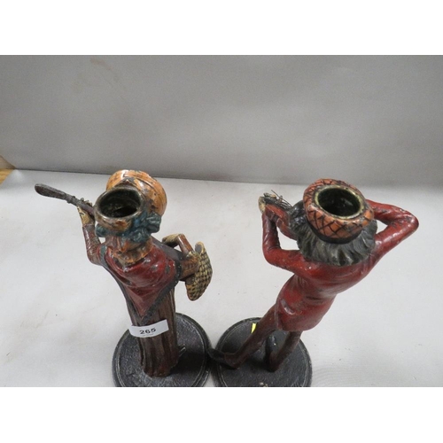 265 - A pair of French cold painted spelter street musicians caricature candlesticks, both signed Francois... 