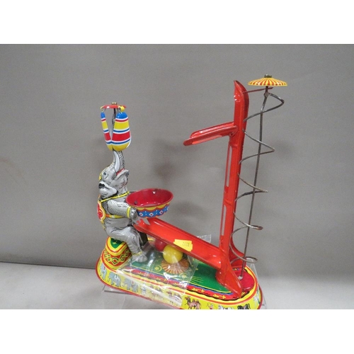 267 - A reproduction circus themed tin plate toy