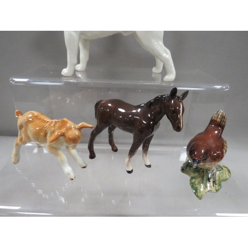 272 - A small collection of Beswick animal figures to include a beagle and a goat