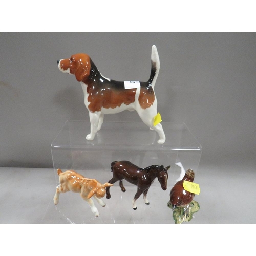 272 - A small collection of Beswick animal figures to include a beagle and a goat