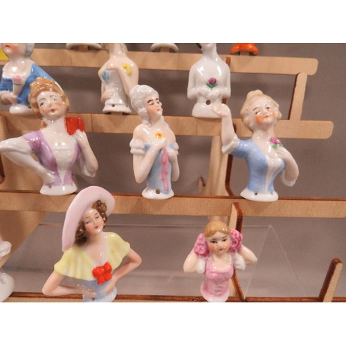 273 - Fourteen vintage pin cushion dolls complete with display stand