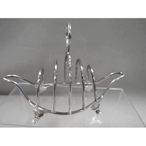 288 - A hallmarked silver wire work four division boat shape toast rack