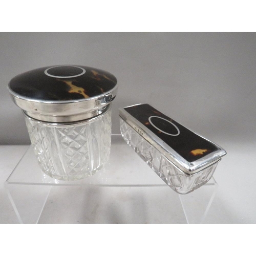 292 - Two hallmarked silver and tortoiseshell lid dressing table jars