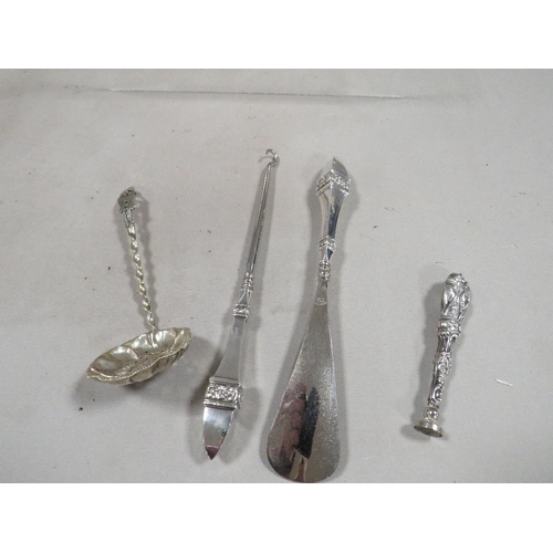 293 - A hallmarked silver handled shoe horn, button hook set, and a sterling silver seal etc