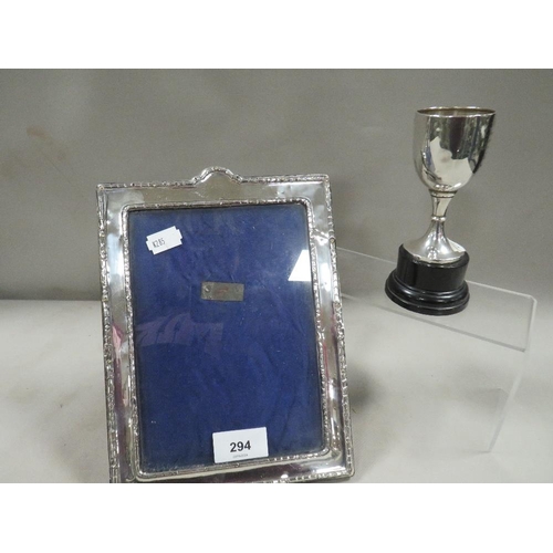 294 - A silver hallmarked photo frame and trophy