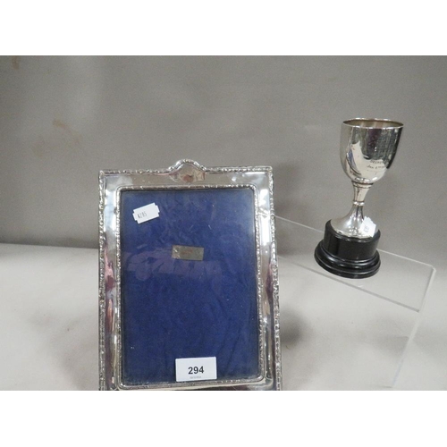 294 - A silver hallmarked photo frame and trophy