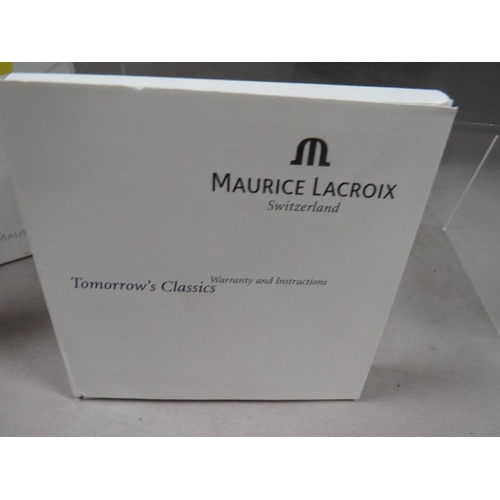 299 - A Maurice Lacroix wrist watch together with box and paper work with guarantee dated 2000