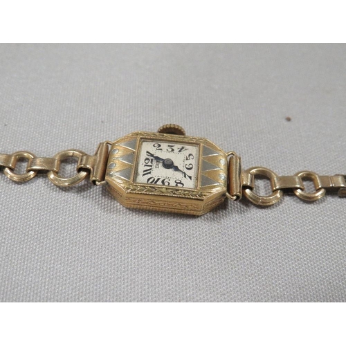 304 - A hallmarked 18k gold wrist watch on a gold plated bracelet