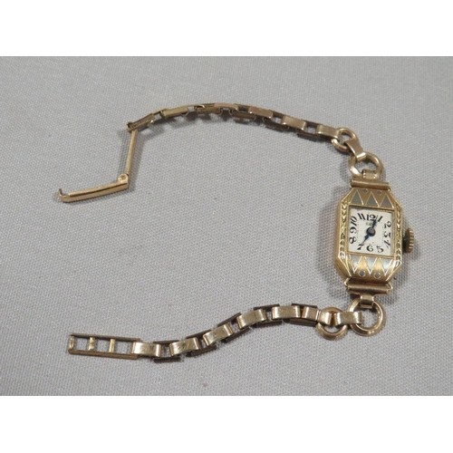 304 - A hallmarked 18k gold wrist watch on a gold plated bracelet