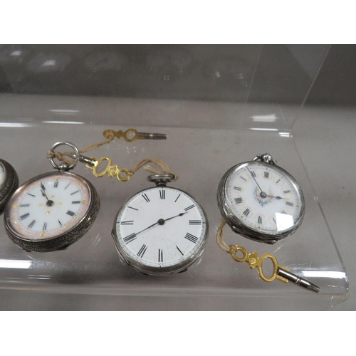 311 - Nine Victorian silver cased pocket watches and keys