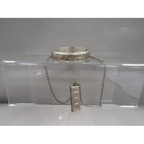 316 - A hallmarked silver ingot on chain together with a hallmarked silver bangle