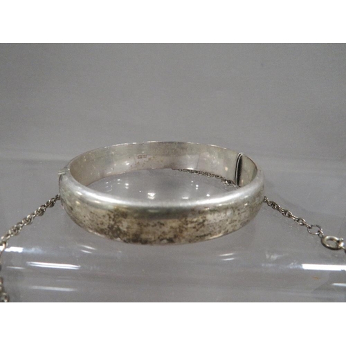 316 - A hallmarked silver ingot on chain together with a hallmarked silver bangle