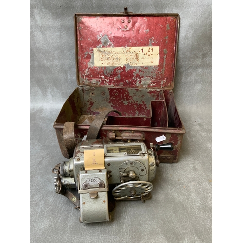 102 - A VINTAGE BUS CONDUCTORS TICKET MACHINE, in a metal case