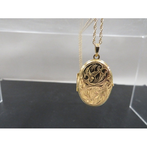 353 - A hallmarked 9 carat gold locket on a 9ct chain overall weight 5.6g