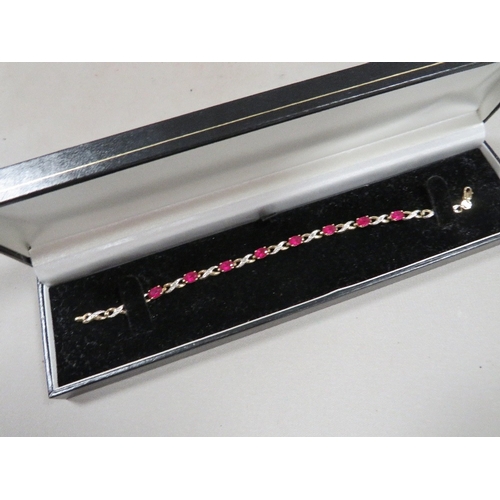 366 - A hallmarked 9 carat gold ruby and diamond bracelet approx. weight 4.1g