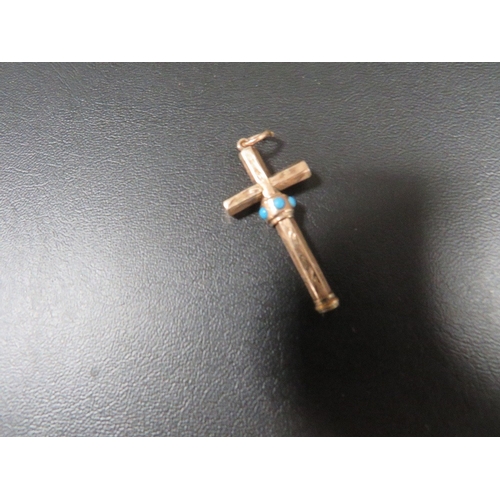 373 - An unusual yellow metal cross pendant with integral slide action pencil , the slider being set with ... 