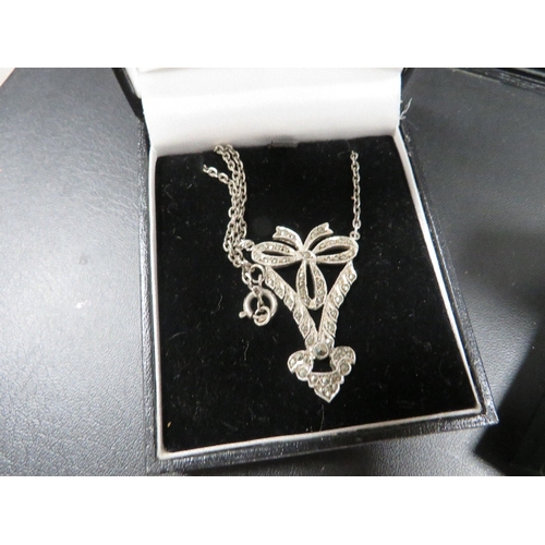 388 - A vintage silver marcasite necklace together with a silver ring