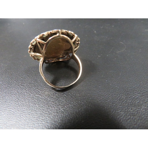 397 - A hallmarked 9 carat gold mounted half sovereign ring dated 1907 approx. overall weight 8.9g