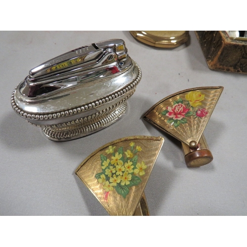 413 - A tray of assorted collectables to include compacts, lipstick holders, cigarette lighters etc