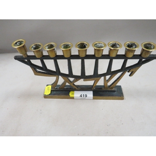 419 - A religious nine candle holder stand