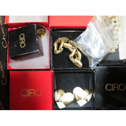 437 - A selection of Ciro and other costume jewellery together with a child's christening outfit ?