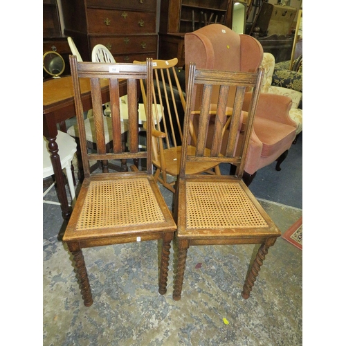 832 - Two oak bergere chairs with barleytwist legs