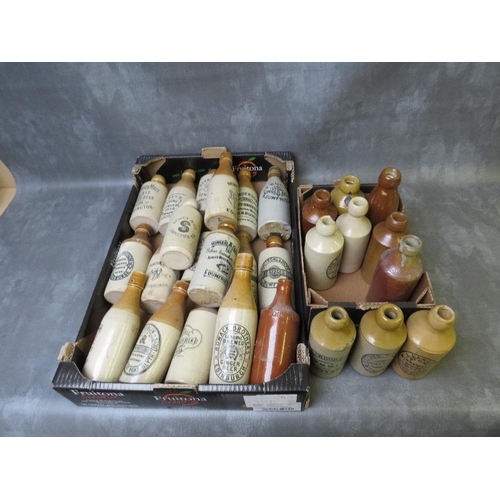 110 - TWO TRAYS OF STONEWARE ADVERTISING BOTTLES, (28)