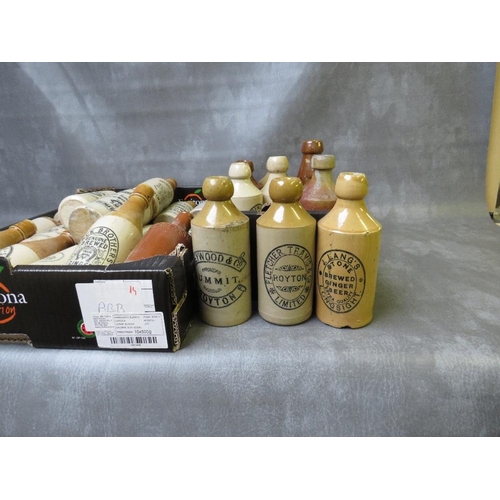 110 - TWO TRAYS OF STONEWARE ADVERTISING BOTTLES, (28)