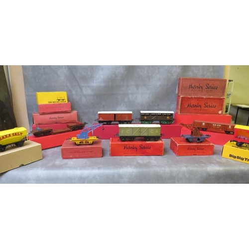 112 - SEVENTEEN BOXED MAINLY HORNBY O GAUGE PIECES OF ROLLING STOCK, to include cattle trucks, crane truck... 