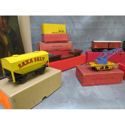 112 - SEVENTEEN BOXED MAINLY HORNBY O GAUGE PIECES OF ROLLING STOCK, to include cattle trucks, crane truck... 