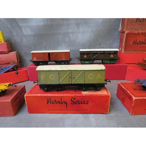 112 - SEVENTEEN BOXED MAINLY HORNBY O GAUGE PIECES OF ROLLING STOCK, to include cattle trucks, crane truck... 