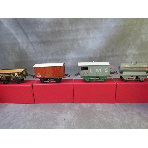 131 - SIXTEEN BOXED HORNBY O GAUGE ROLLING STOCK, to include tankers, covered and uncovered wagons